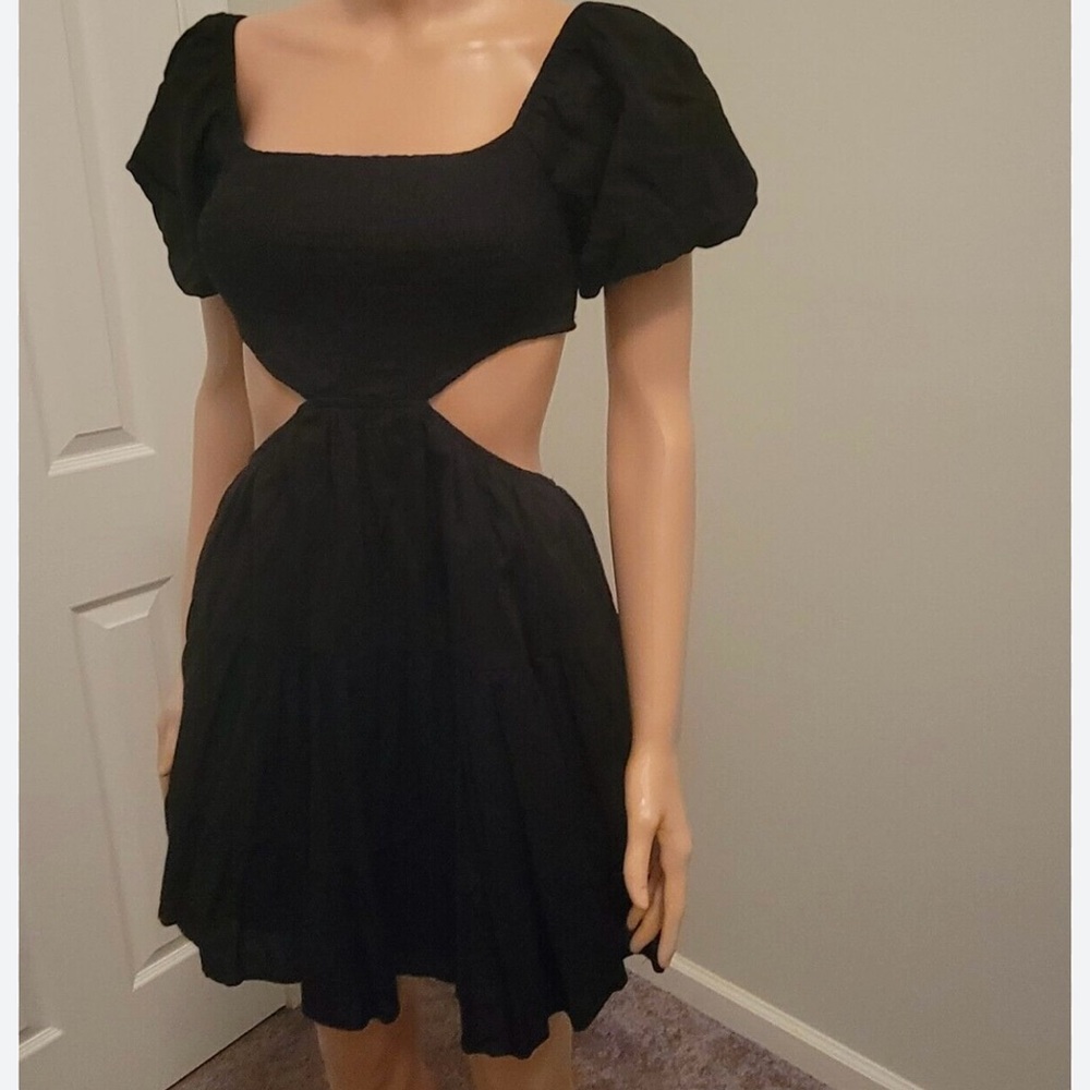 Black cut out puff sleeve dress! So flattering and cute! Worn twice!